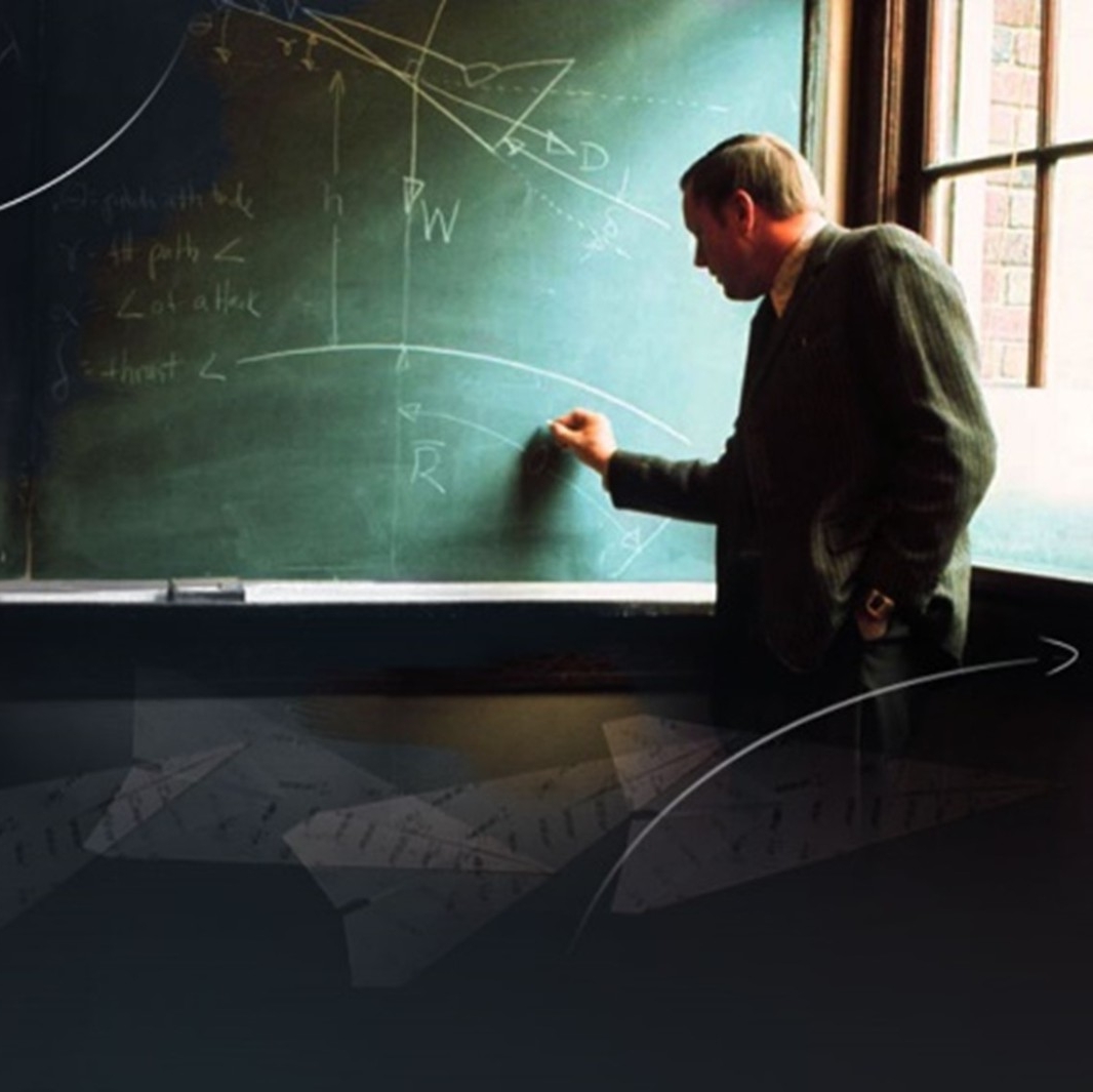 Neil Armstrong standing in front of a chalkboard