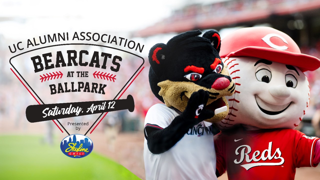 Bearcat Mascot and Reds Mascot posing for photo with date of event