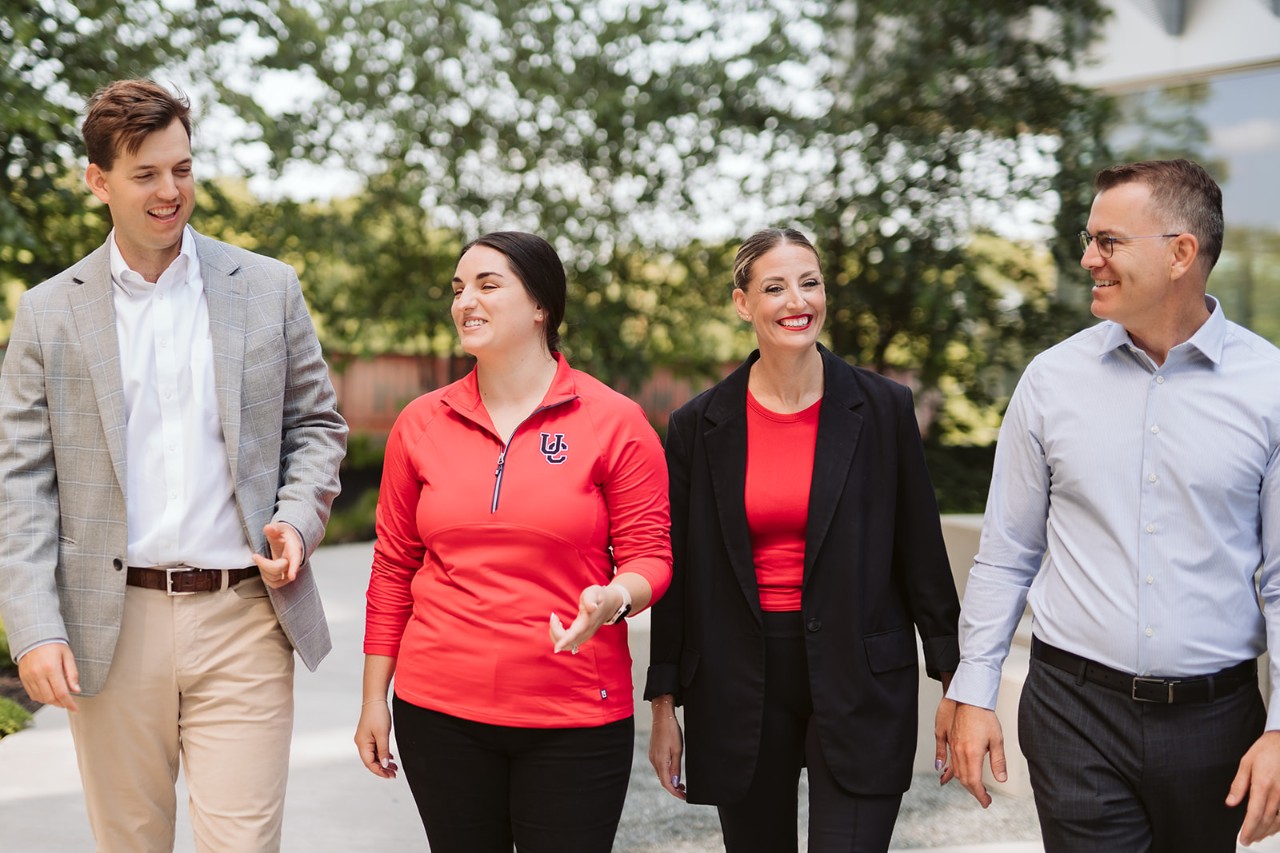 UC Alumni walking on campus